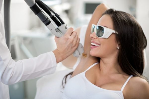 woman getting laser hair removal e1555707054112